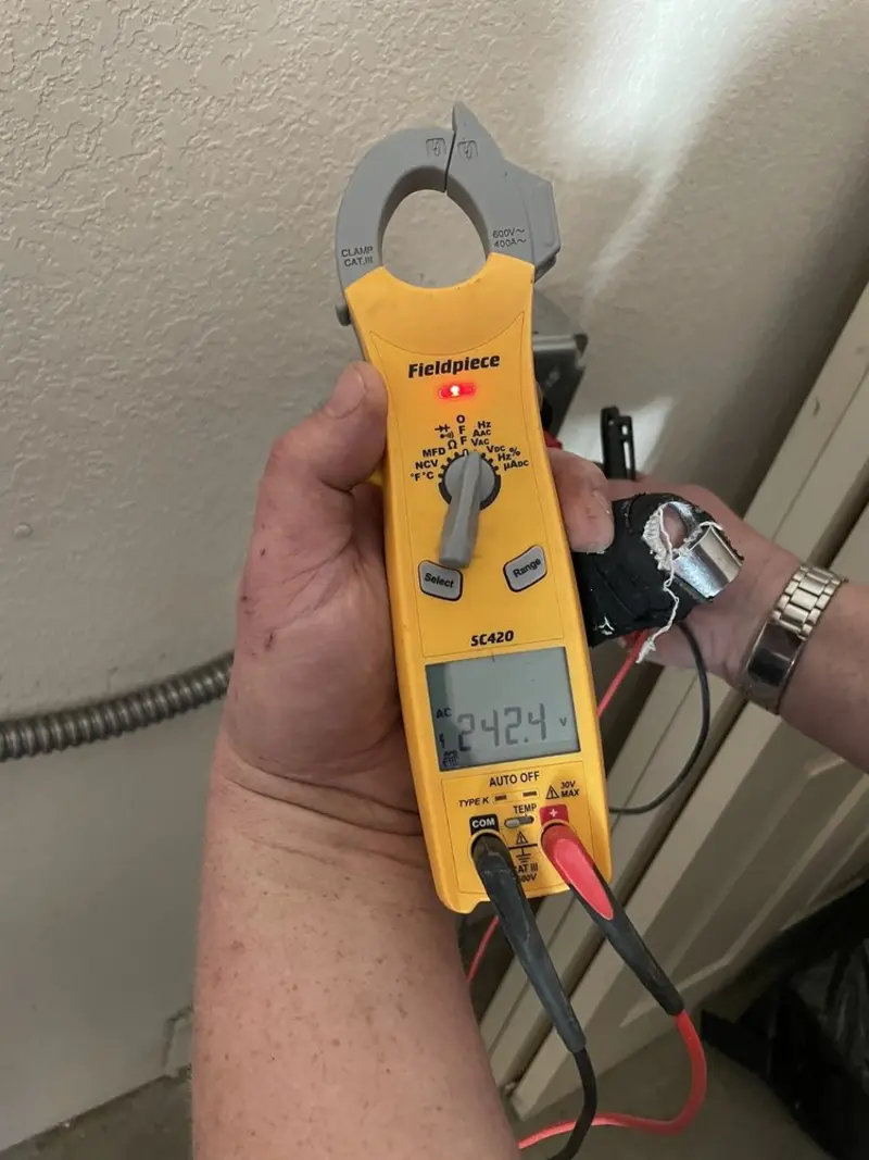 Voltage testing with clamp meter during Electrical Installation Services in Laramie